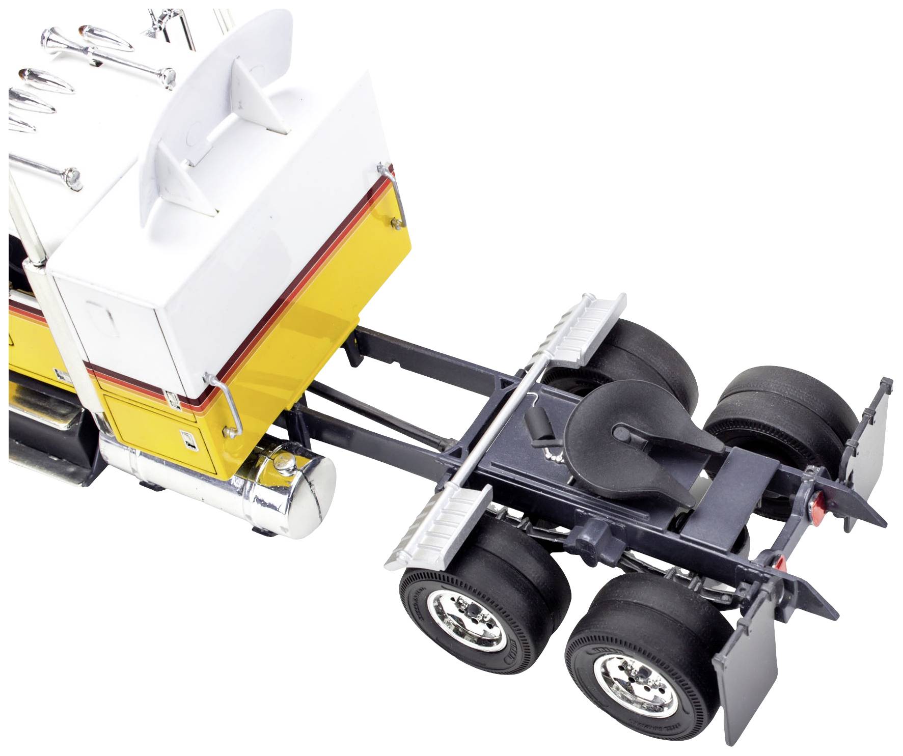 Gelbes Modell eines Lastwagens ohne Anhänger, aufgenommen aus leicht erhöhtem Winkel. Zu sehen sind die Rückseite und Fahrgestell.