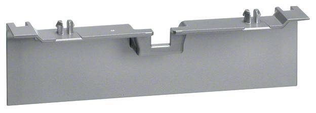 Ein graues Metallstück mit unterschiedlichen Höhen, möglicherweise ein Bauteil oder Adapter.