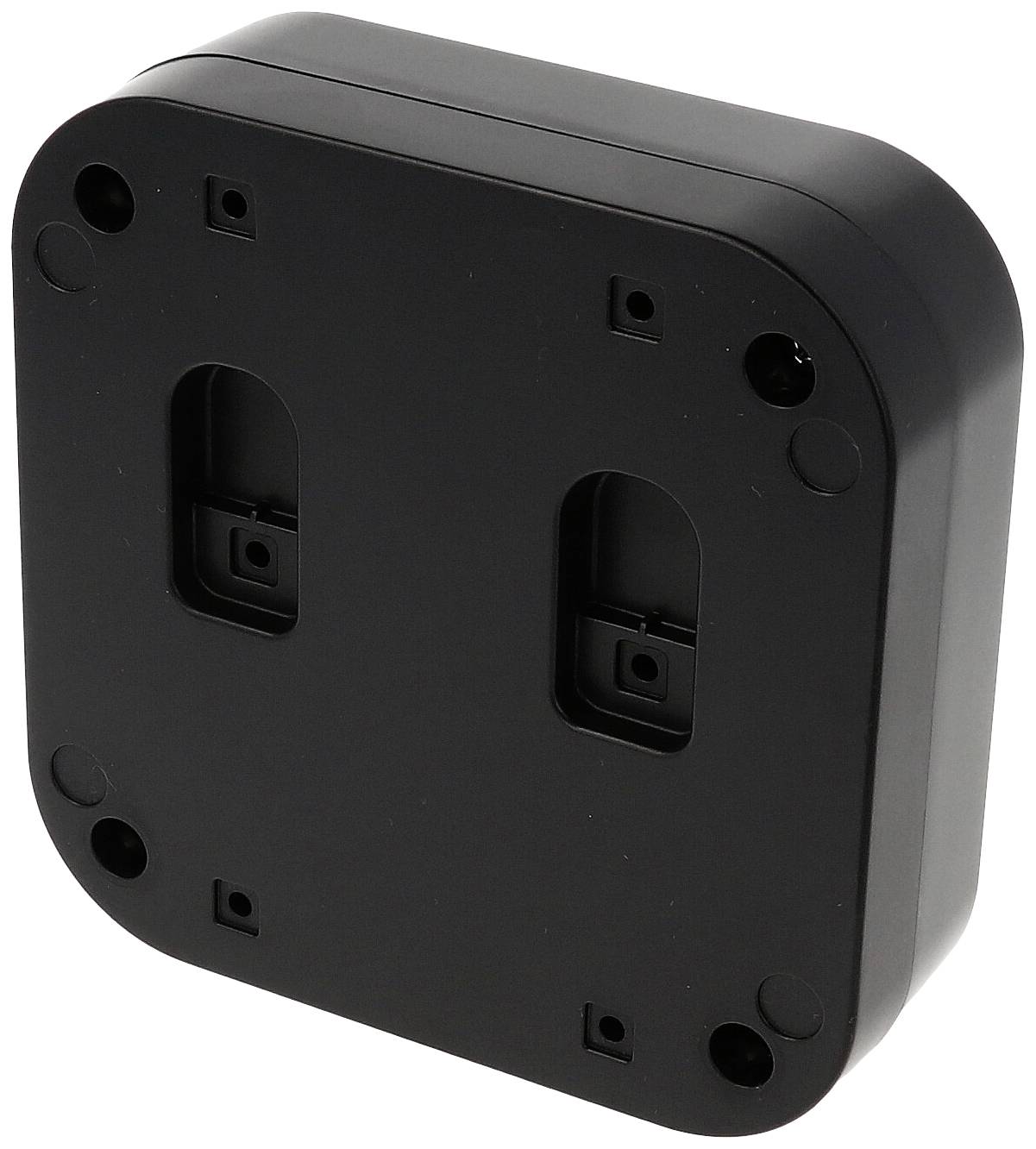Rückseite eines quadratischen, schwarzen Kunststoffgehäuses mit abgerundeten Ecken und mehreren Montageschraubenlöchern.