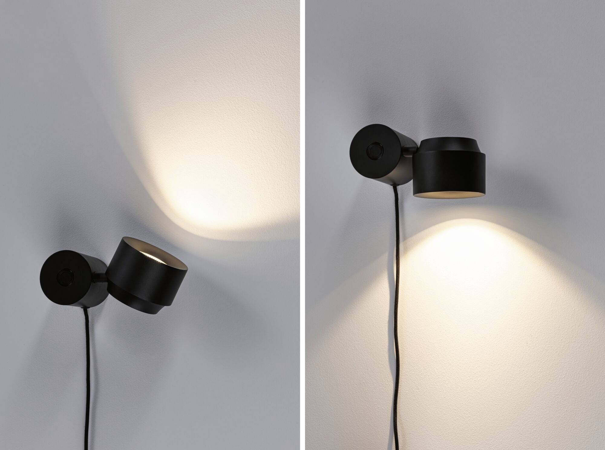 Zwei minimalistische schwarze Wandlampen an einer grauen Wand, eine links beleuchtet die Wand schräg, die andere nach unten.