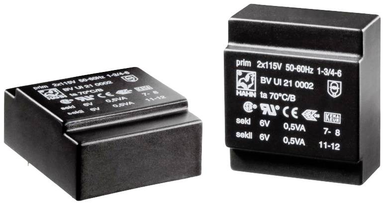 Zwei schwarze Transformatoren mit Kennzeichnungen. Aufschrift zeigt technische Spezifikationen, z.B. 'prim 2x115V' und 'sek 6V, 0,5VA'.