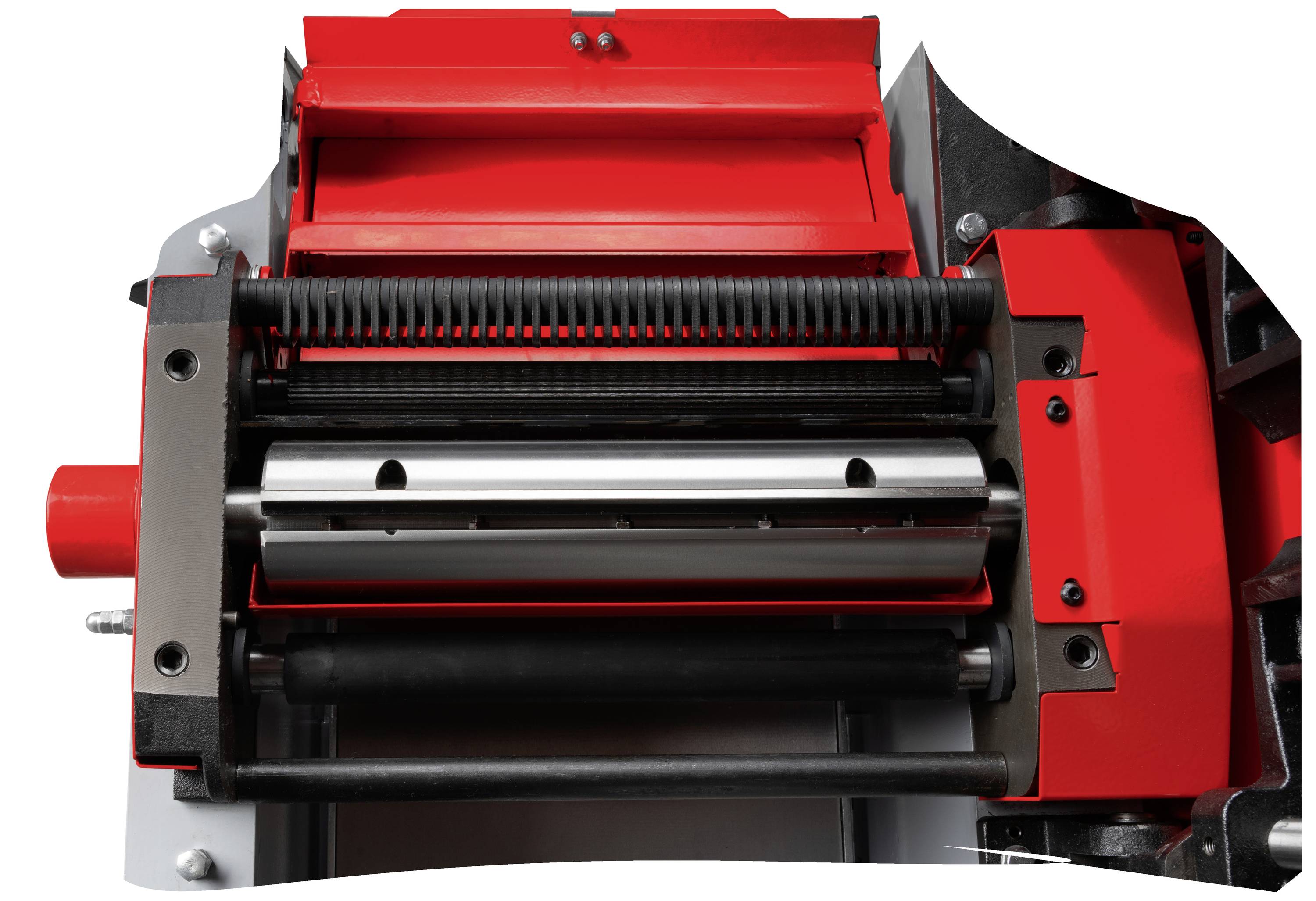 Eine rote und schwarze industrielle Maschine mit Walzen und Hebel, möglicherweise ein Presswerkzeug, wird aus der Nähe gezeigt.