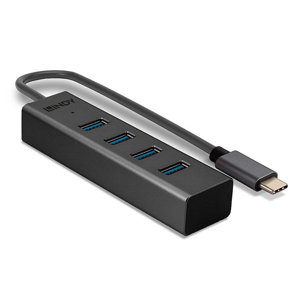 Ein schwarzer USB-C-Hub mit vier blauen USB-A-Anschlüssen. Verbindet verschiedene USB-Geräte mit einem USB-C-Kabel.