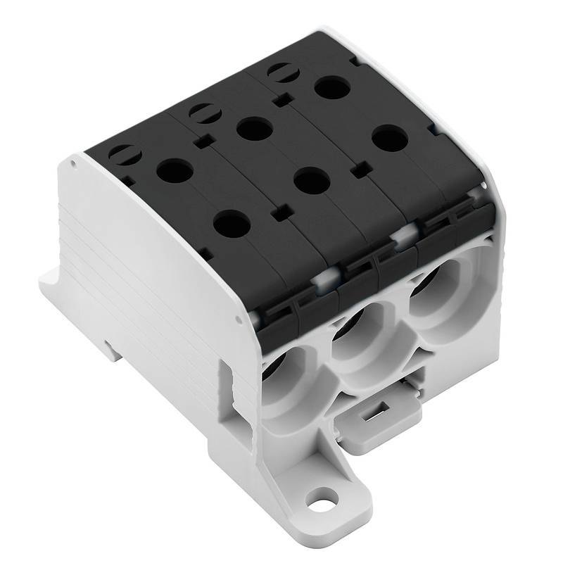 Ein weiß-schwarzer elektrischer Klemmenblock mit vier Anschlüssen für Verkabelung, montiert auf einer flachen Basis.