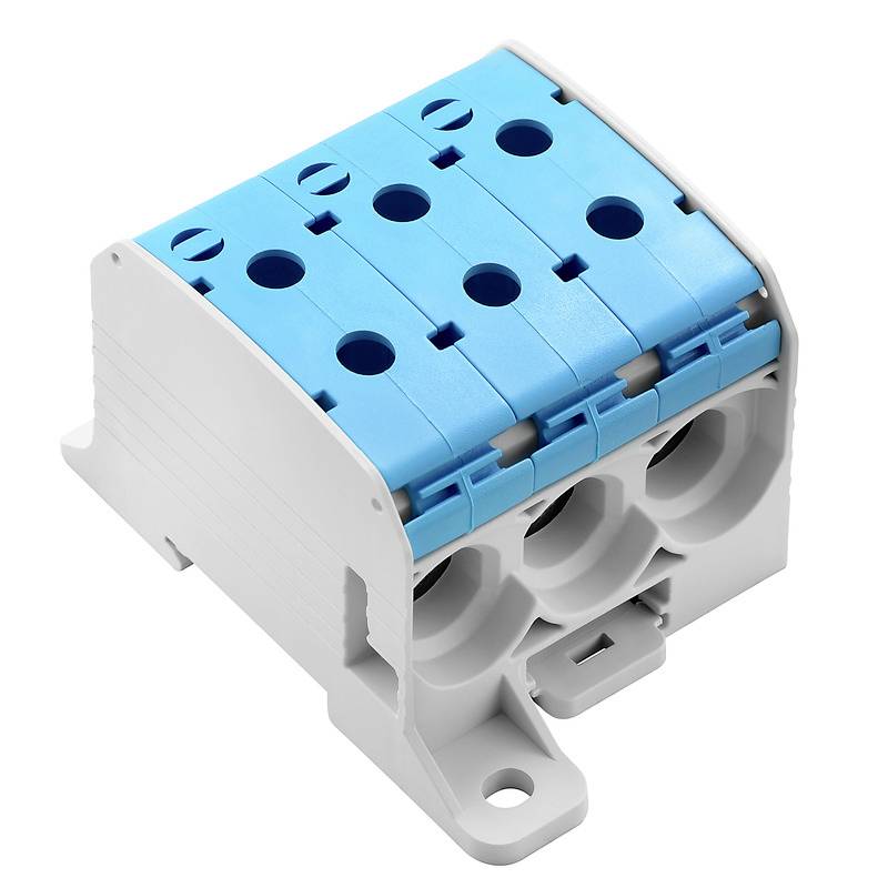 Ein grauer und blauer elektrischer Verteilerblock mit mehreren Kabeleingängen zur Organisation und Verteilung von Stromleitungen.