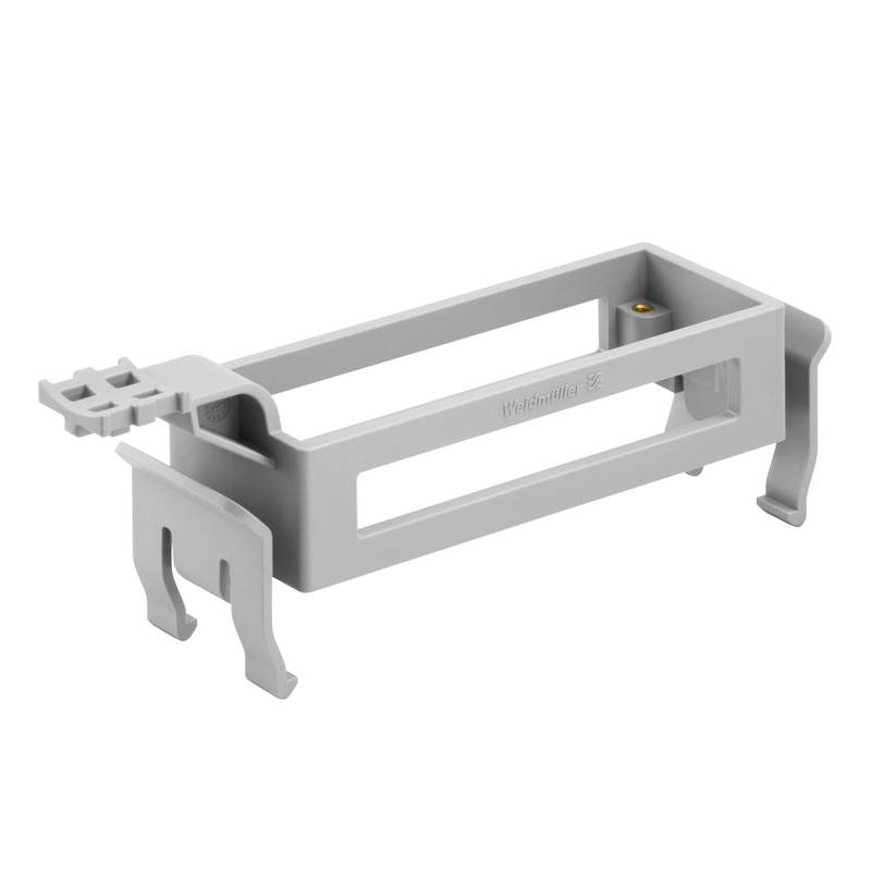 Graues, rechteckiges Kunststoffteil mit Füßen an beiden Enden, möglicherweise als Halterung oder Befestigungselement verwendet.