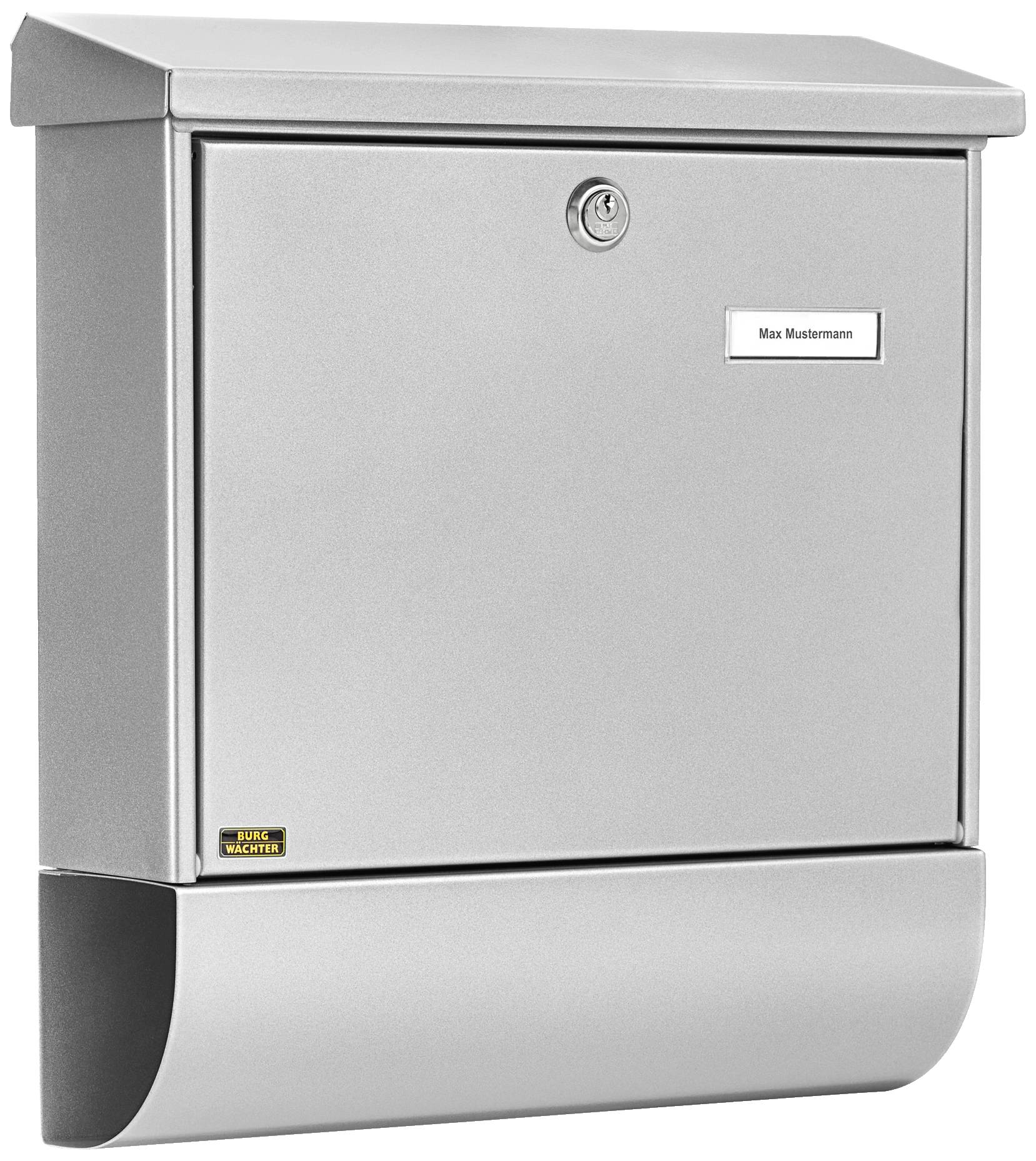 Silberner Briefkasten mit Schloss und Namensschild 'Max Mustermann'. Platz für Zeitungen unten.