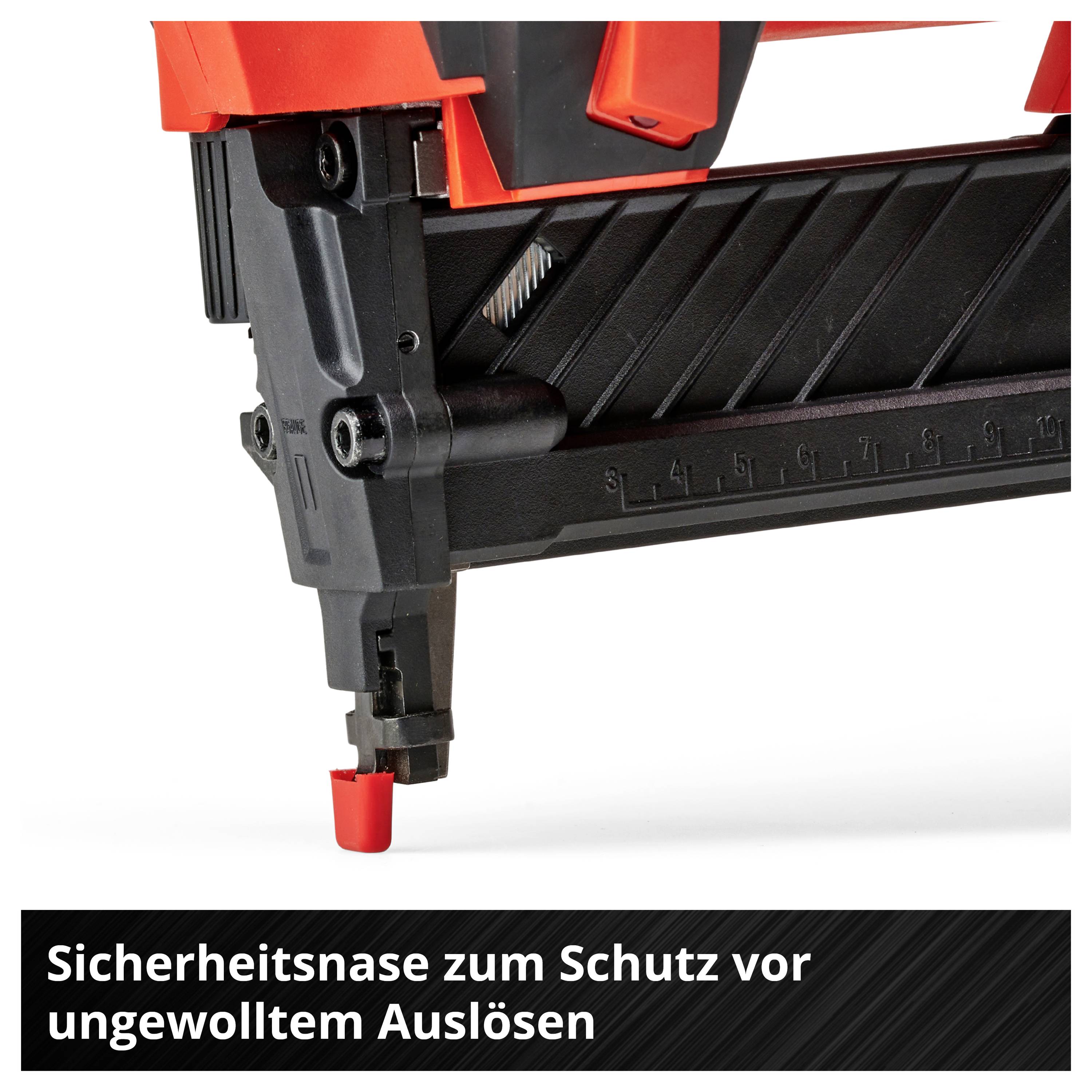 Nahaufnahme eines roten und schwarzen Druckluftnaglers mit Sicherheitsnase; Text: 'Sicherheitsnase zum Schutz vor ungewolltem Auslösen'.
