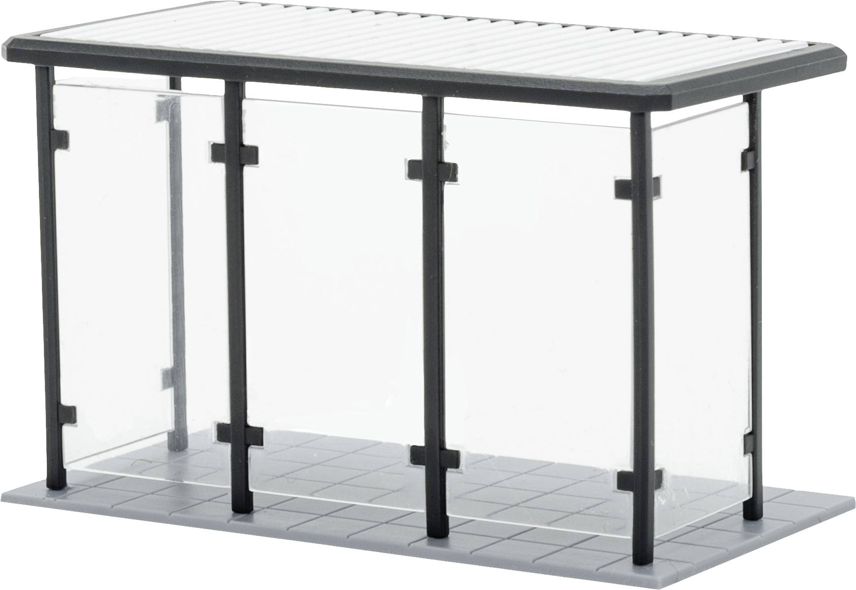 Ein kleiner Wartebereich mit Glaswänden und Flachdach, geeignet für eine Bushaltestelle oder einen Unterstand.