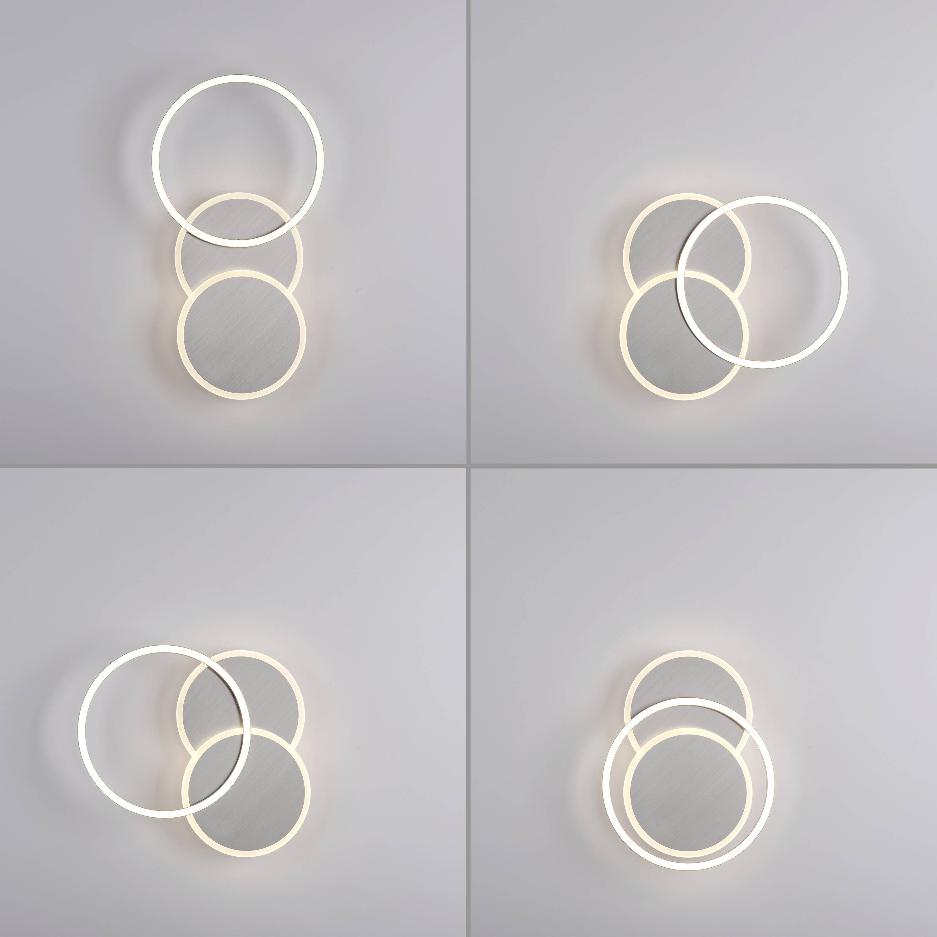 Vier runde LED-Leuchten in verschiedenen Anordnungen vor grauem Hintergrund. Jede Lampe besteht aus zwei sich überschneidenden Kreisen.