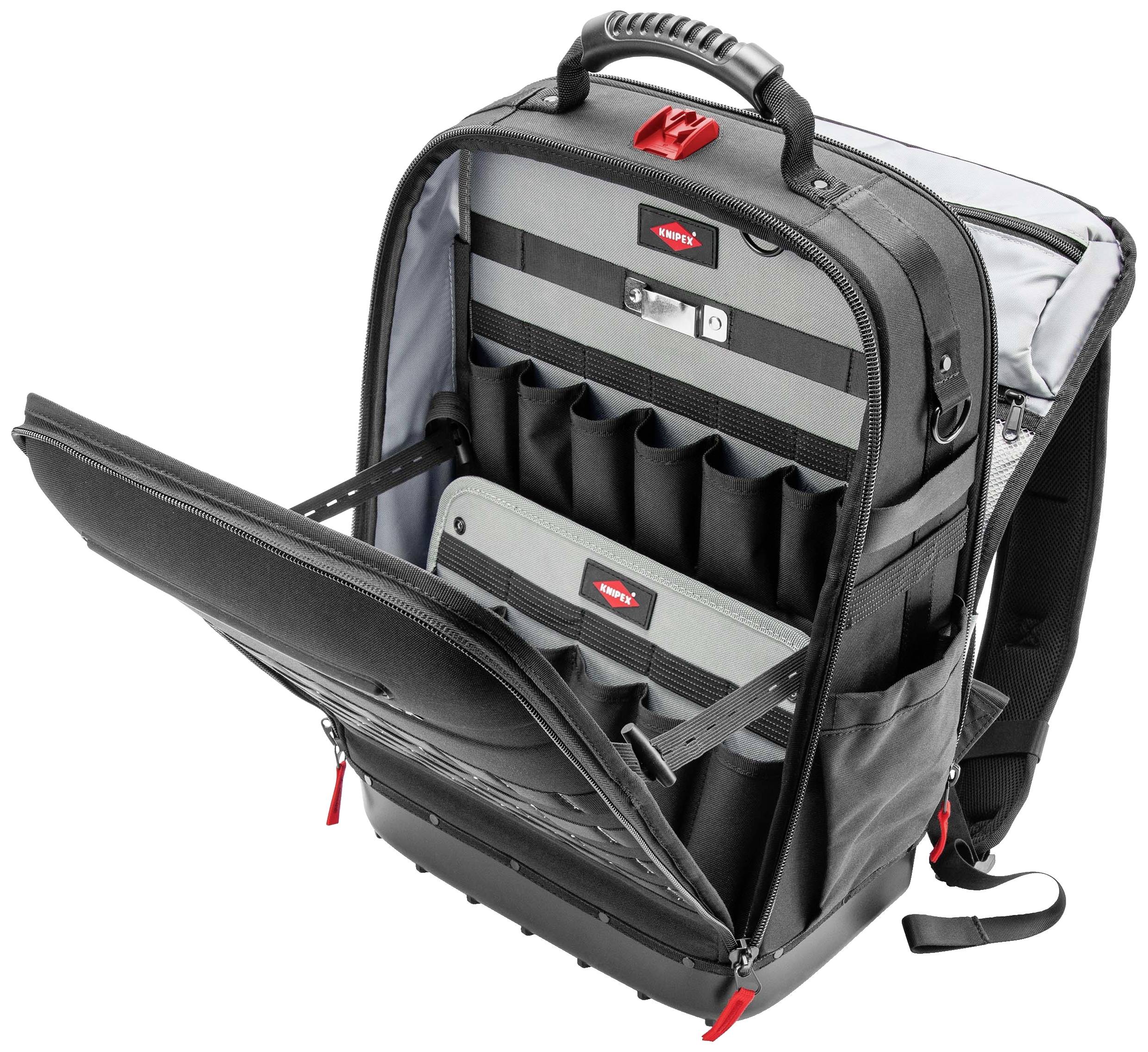 Ein offener, schwarzer Werkzeug-Rucksack mit mehreren Fächern, Schlaufen und einem Griff.