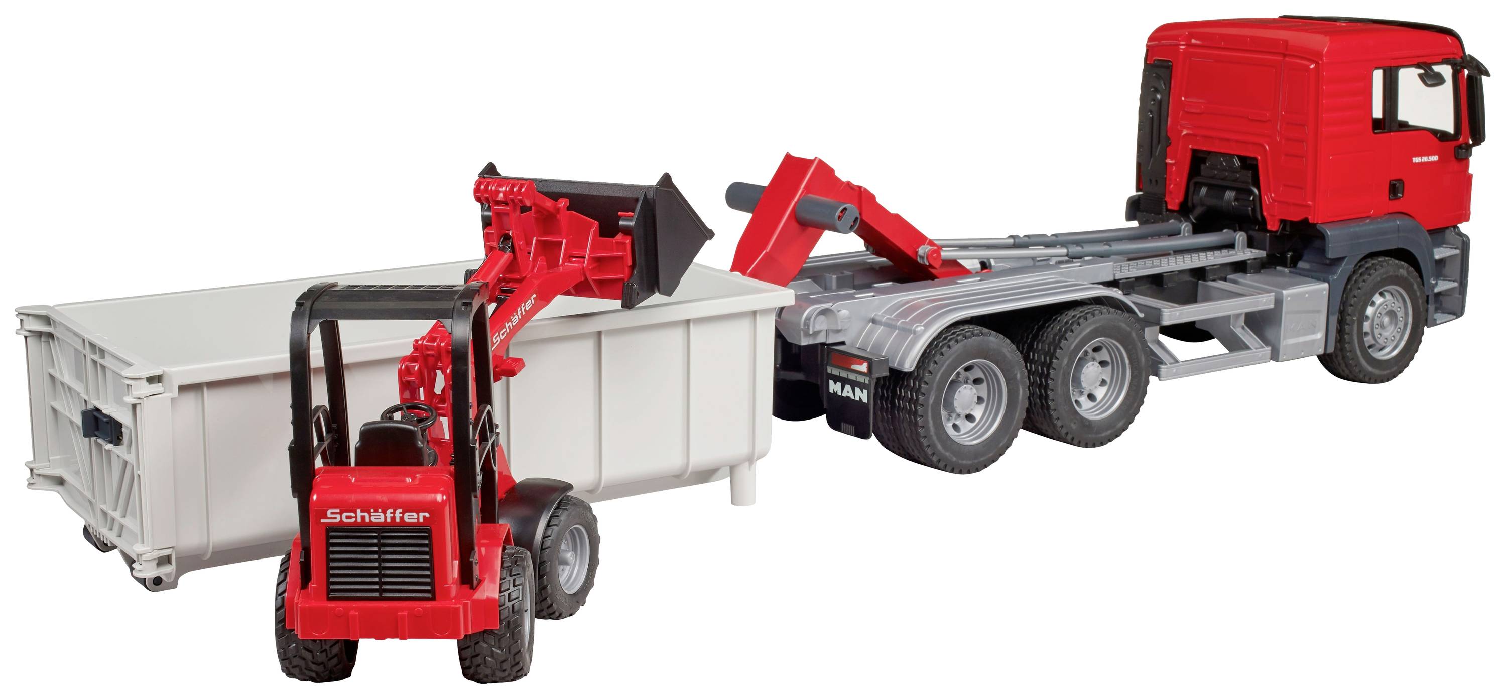 Ein roter Spielzeug-LKW zieht einen weißen Container. Ein roter Spielzeugbagger steht neben dem Container.