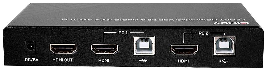 Ein schwarzer HDMI Switch mit mehreren Anschlüssen: zwei HDMI-Ausgänge, zwei USB-Anschlüsse für PC 1 und PC 2, DC/5V Stromanschluss.