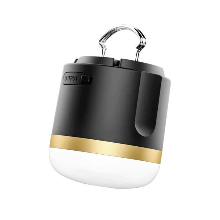 Eine tragbare LED-Campinglampe in Schwarz und Gold mit Aufhängegriff. Oben befindet sich ein 