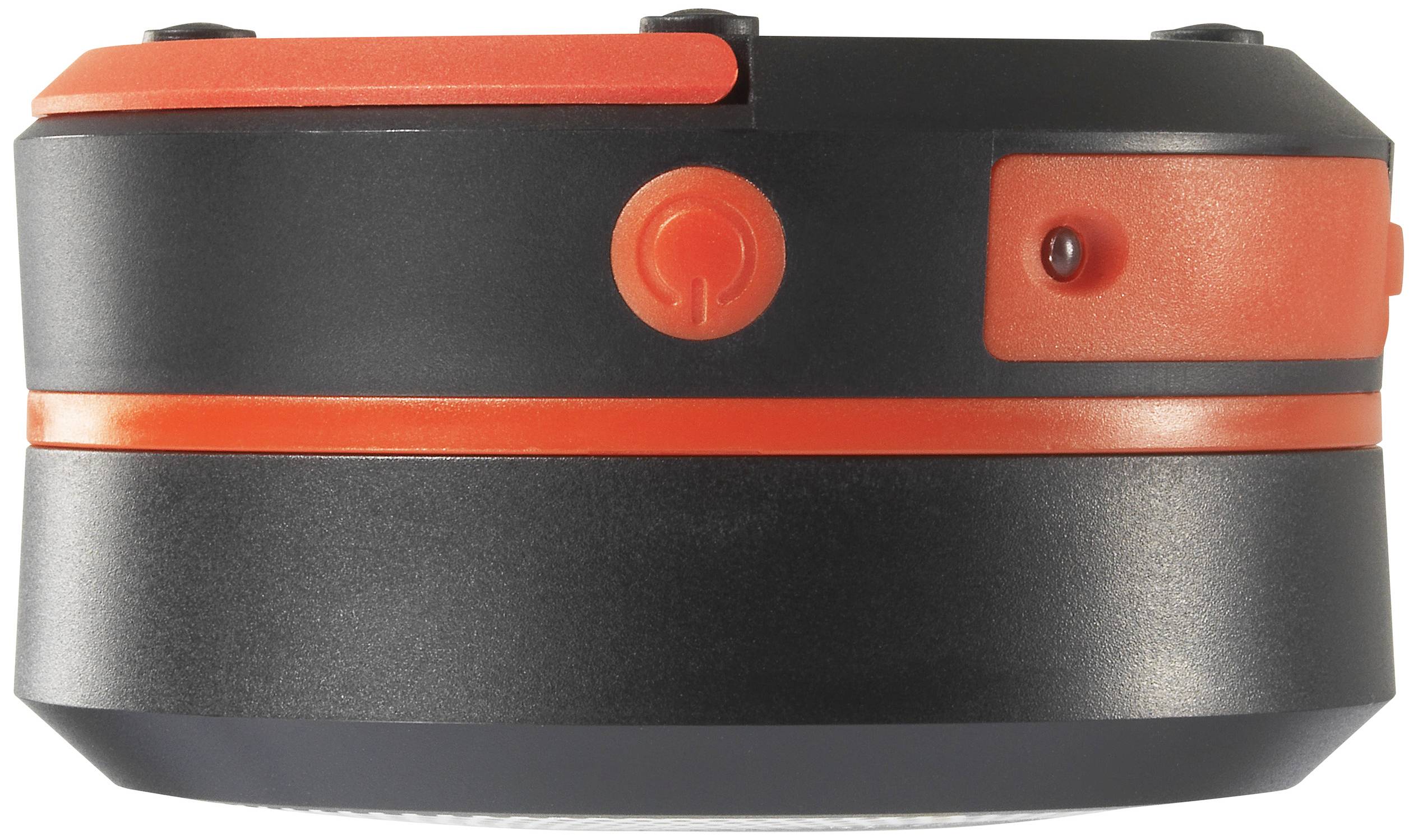 Ein schwarzer und roter Knopf an einem Gerät, möglicherweise zur Steuerung oder Aktivierung. Elegantes, kompaktes Design.