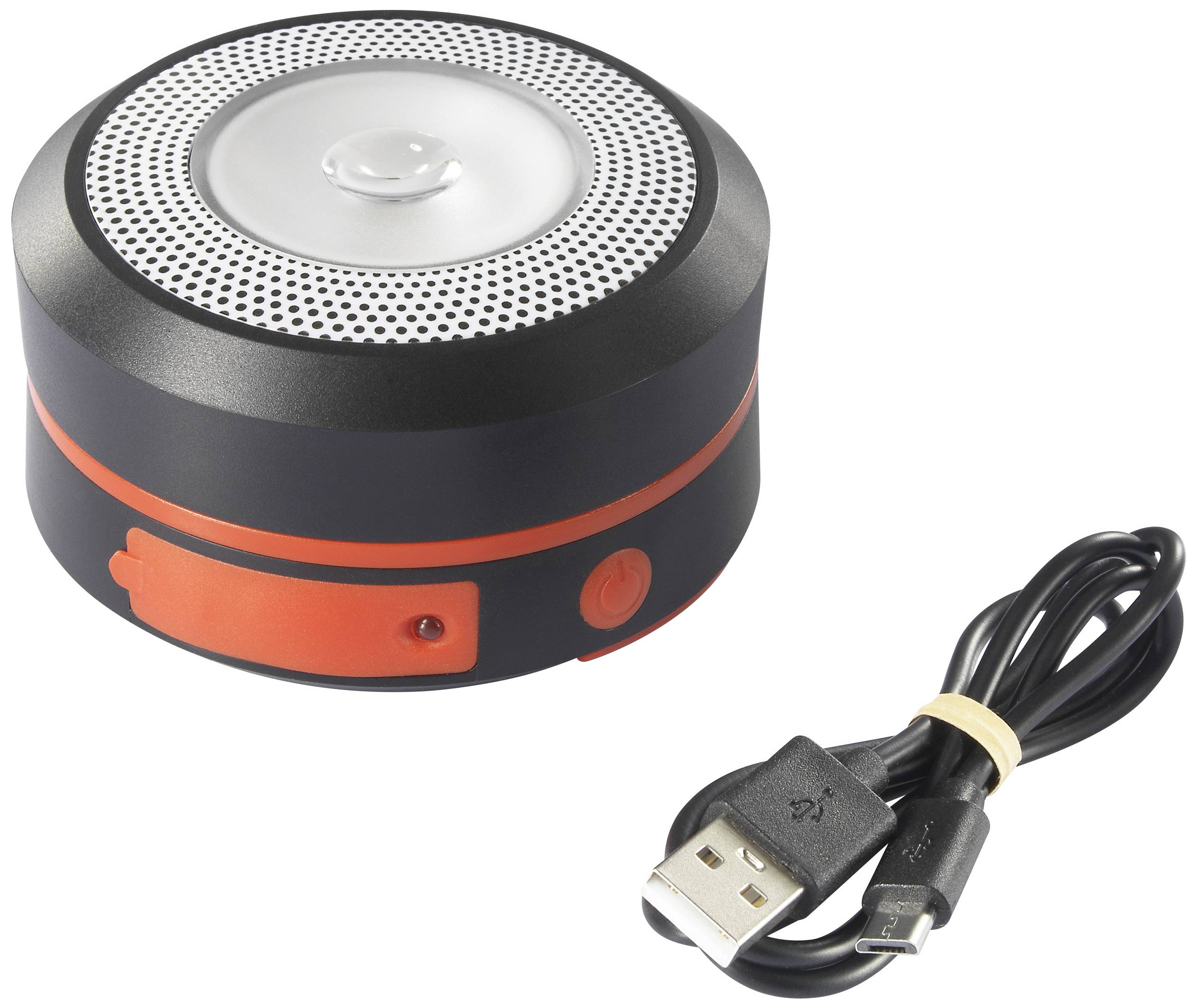 Tragbarer, runder Bluetooth-Lautsprecher mit schwarzem und rotem Gehäuse. Daneben liegt ein USB-Ladekabel.