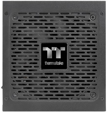 Schwarzes Computer-Netzteil von Thermaltake mit Lüftergitter und Logo in der Mitte.