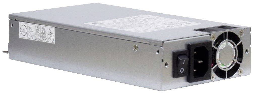 Ein silbernes Netzteil mit Ventilator und Ein-/Ausschalter, rechteckige Form. Energiespezifikationen auf einem Etikett.