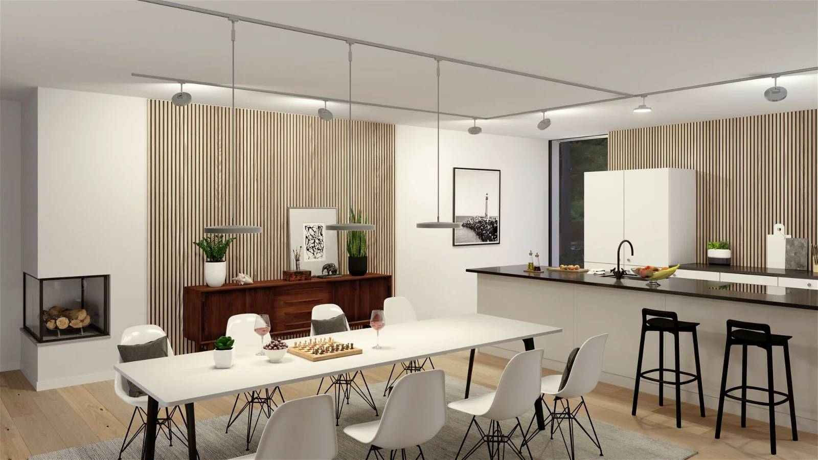 Ein moderner Essbereich mit weißem Tisch, Stühlen und heller Küche im Hintergrund. Ein hölzernes Sideboard mit Pflanzen und Kunstwerken daneben.