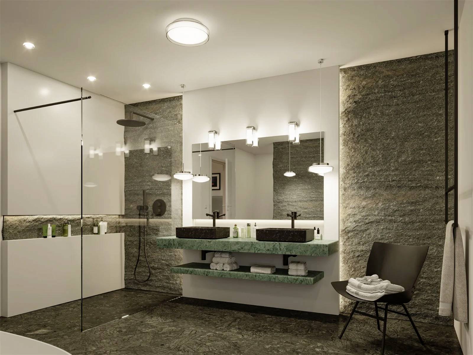 Modernes Badezimmer mit grauen Steinfliesen, Doppelwaschbecken mit grüner Ablage, beleuchteten Spiegeln, Dusche und Badewanne.