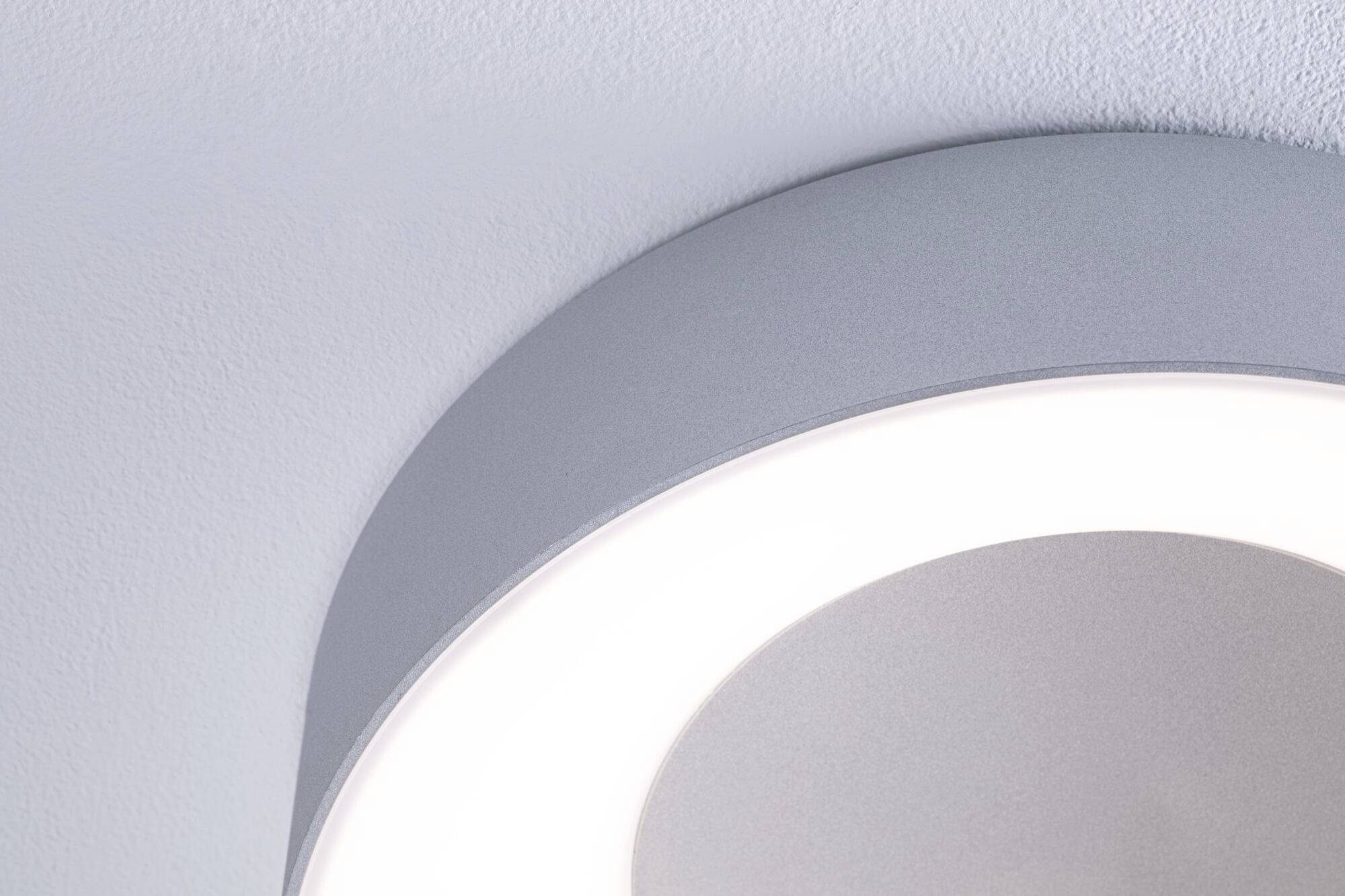 Eine moderne Deckenleuchte mit rundem, minimalistischen Design, die sanftes, weißes Licht ausstrahlt.