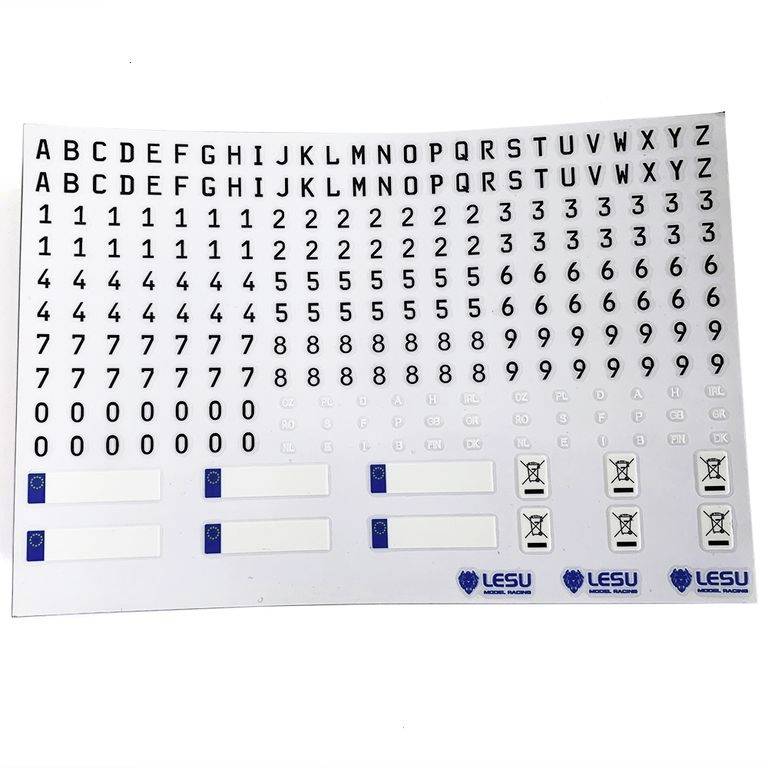 Ein Blatt mit schwarzen Buchstaben von A bis Z und Zahlen von 0 bis 9, darunter blaue und weiße Lesu-Logos sowie kleine Symbole.