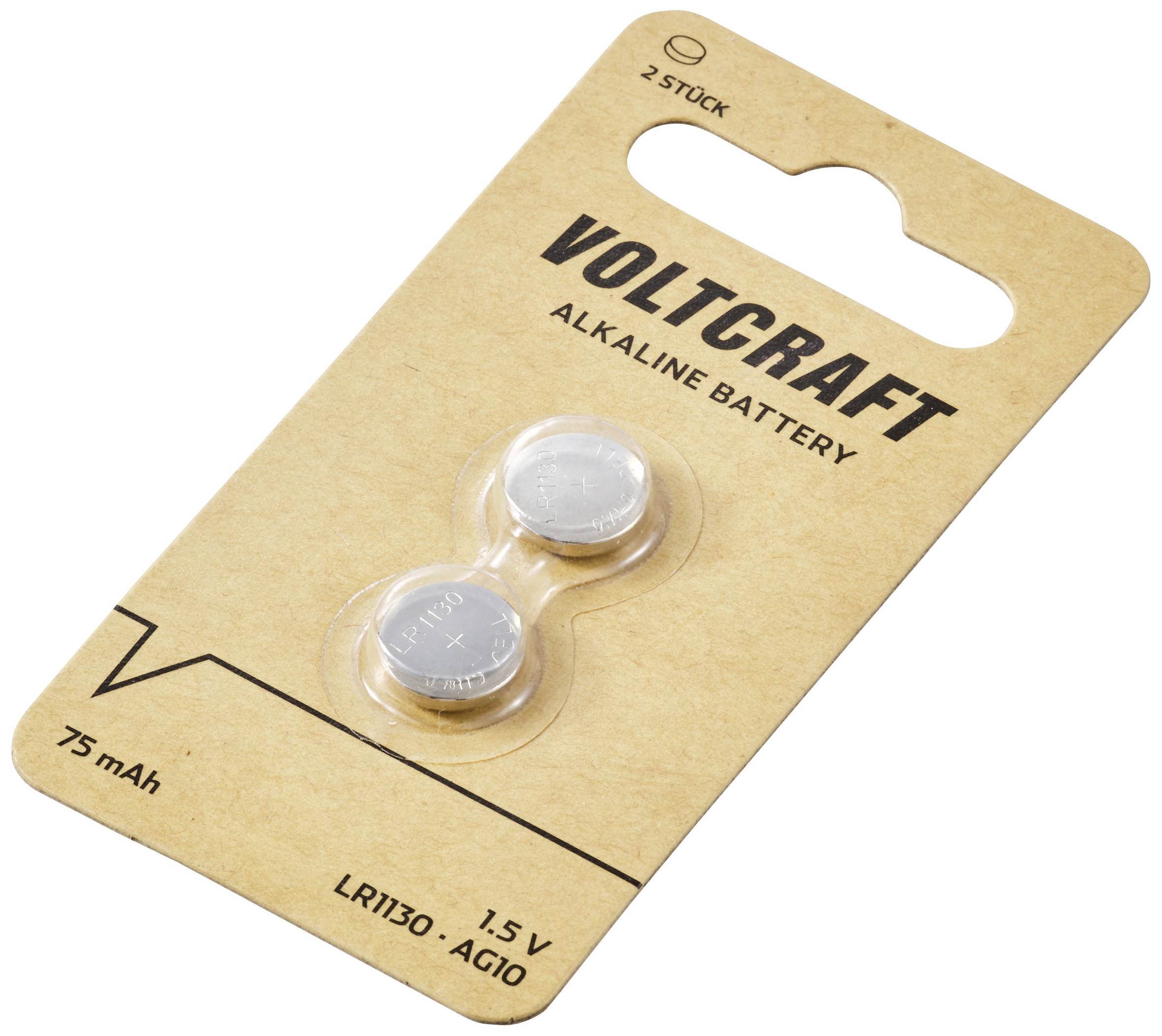 Zwei kleine Knopfzellenbatterien auf einer braunen Verpackung von Voltcraft, beschriftet mit '75 mAh, 1.5 V, LR1130, AG10'.