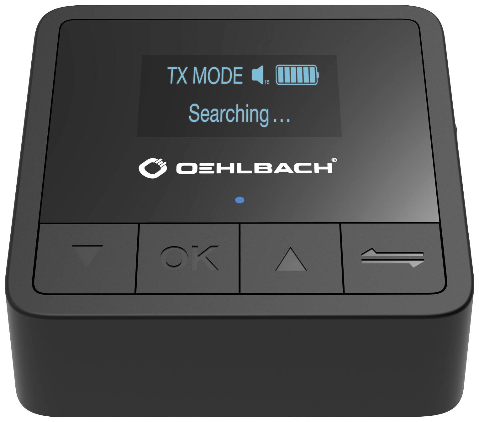 Ein quadratisches elektronisches Gerät mit Display zeigt 'TX MODE' und 'Searching...'. Darunter befinden sich Steuerknöpfe.