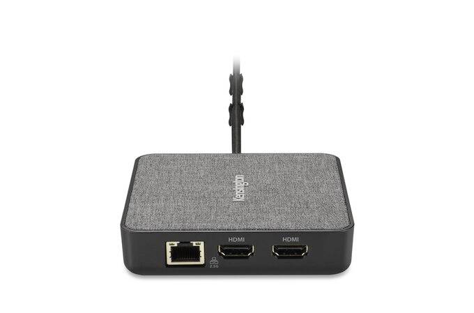 Kleines schwarzes Gerät mit Stoffoberfläche, zwei HDMI-Anschlüssen und einem Ethernet-Anschluss, Oberseite mit unscharfem Logo.