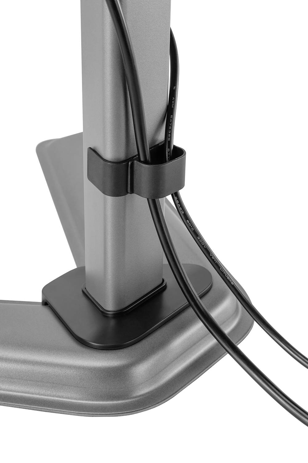 Kabelhalter, der zwei schwarze Kabel an einem grauen Metallständer organisiert. Die Kabel sind ordentlich befestigt.