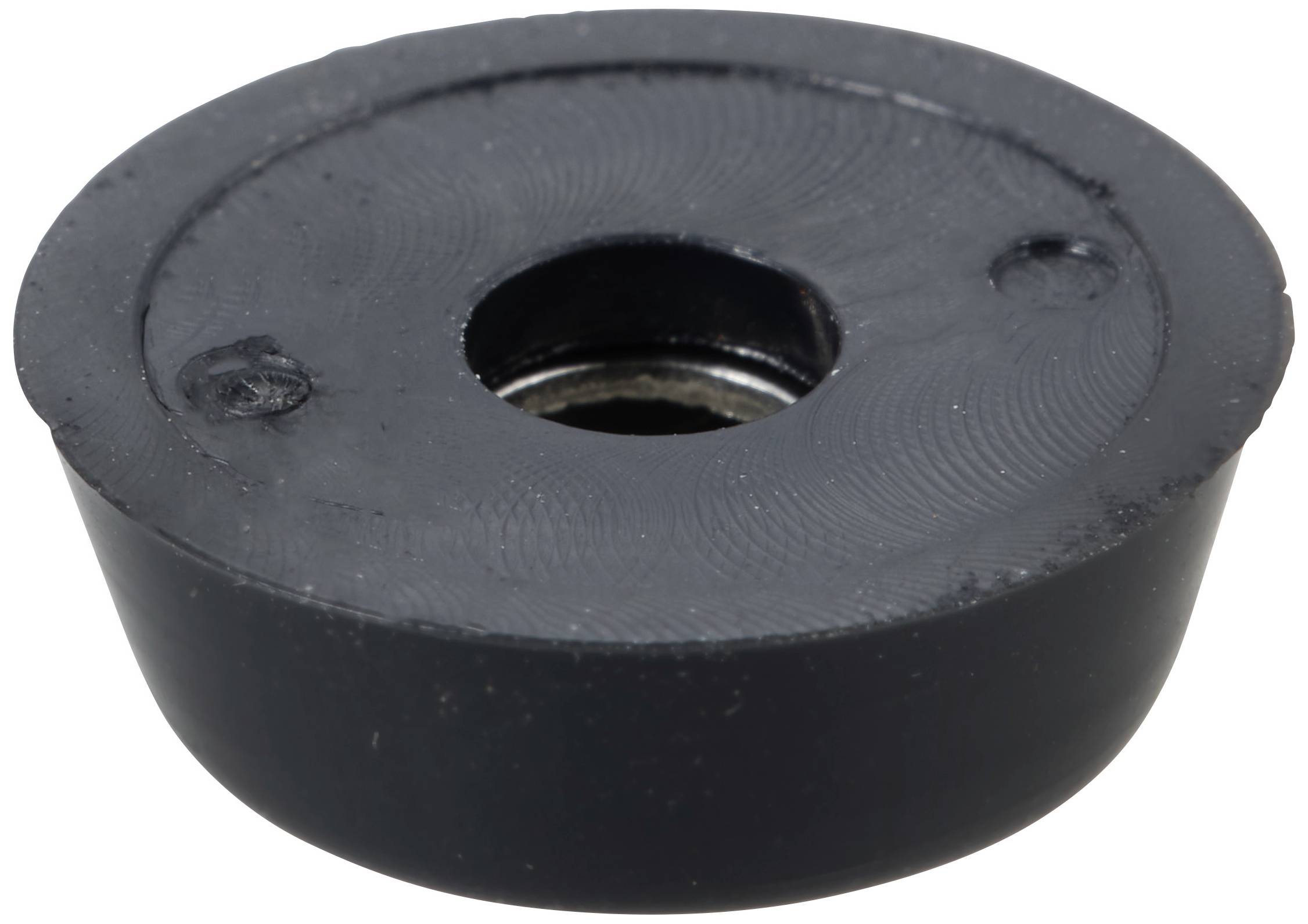 Ein schwarzes Kunststoffteil mit einem zentralen Loch, typisch für den Einsatz in mechanischen oder elektronischen Anwendungen.