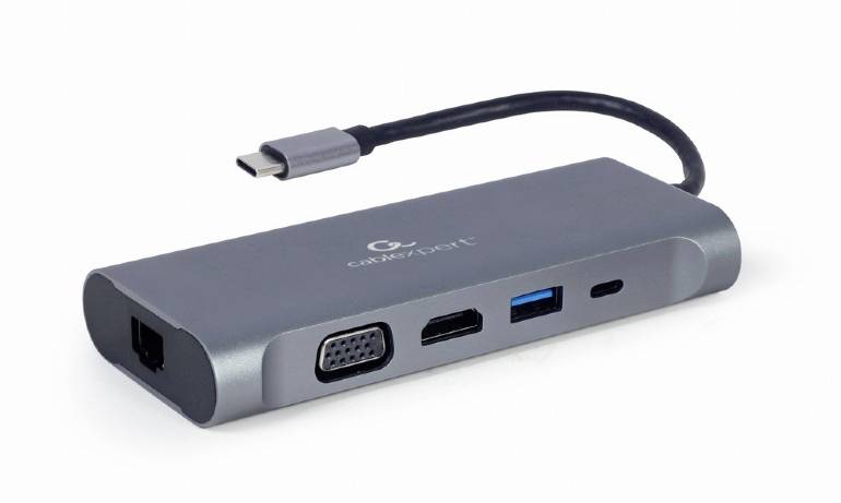 Ein grauer USB-C-Hub mit mehreren Anschlüssen, darunter HDMI, VGA, USB 3.0 und Ethernet-Anschluss, verbunden durch ein kurzes Kabel.