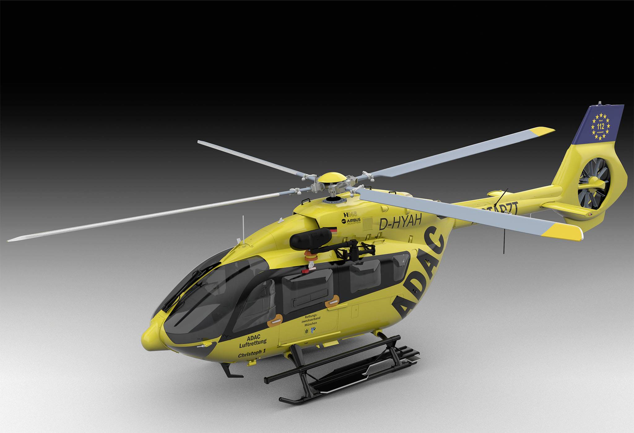 Gelber Rettungshubschrauber des ADAC mit Schriftzug. Das Fahrzeug hat zwei Rotorblätter und ist für Notfalleinsätze ausgerüstet.