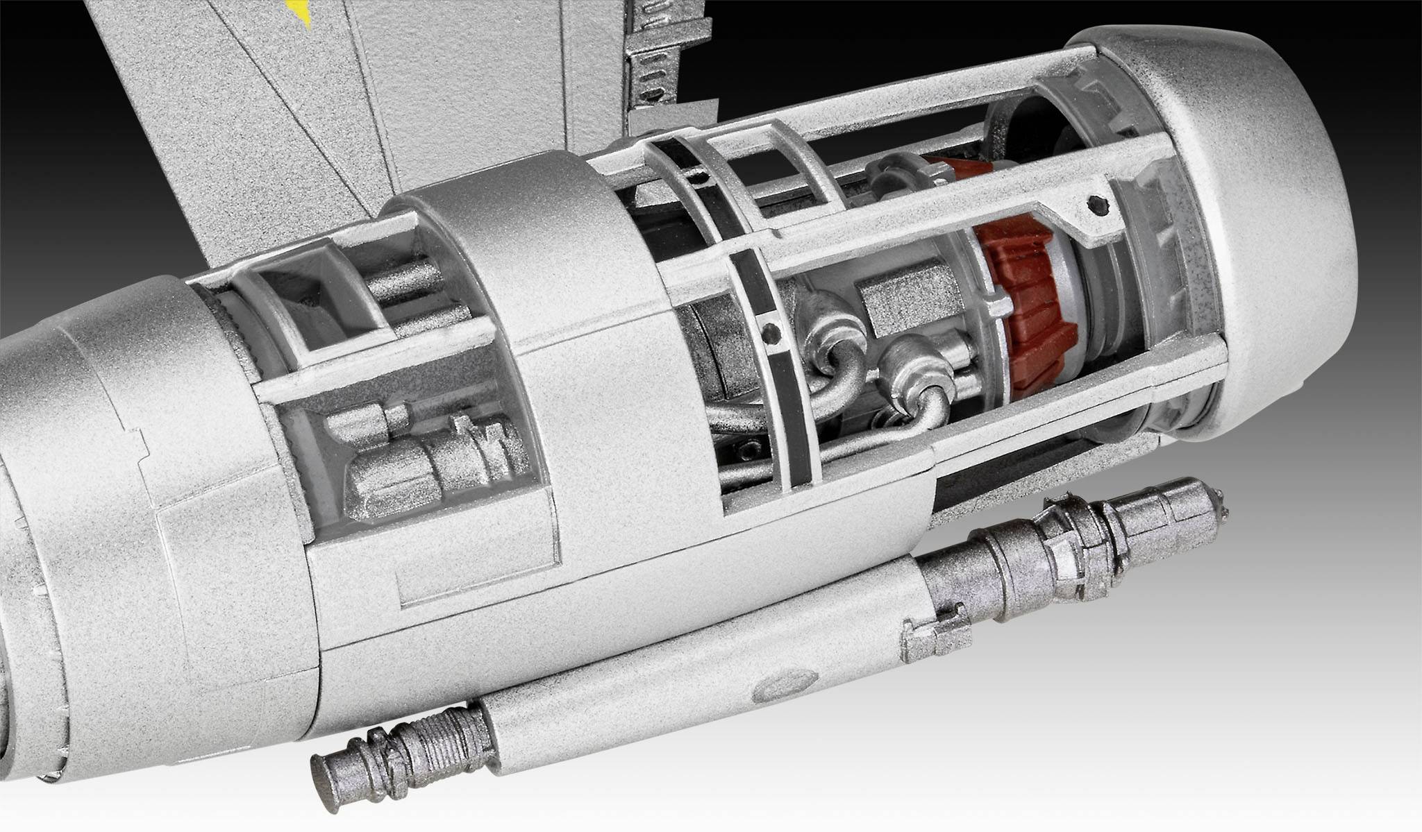 Ein detailliertes Modell eines futuristischen Triebwerks mit sichtbaren technischen Komponenten und Rohren in einem silbernen Gehäuse.