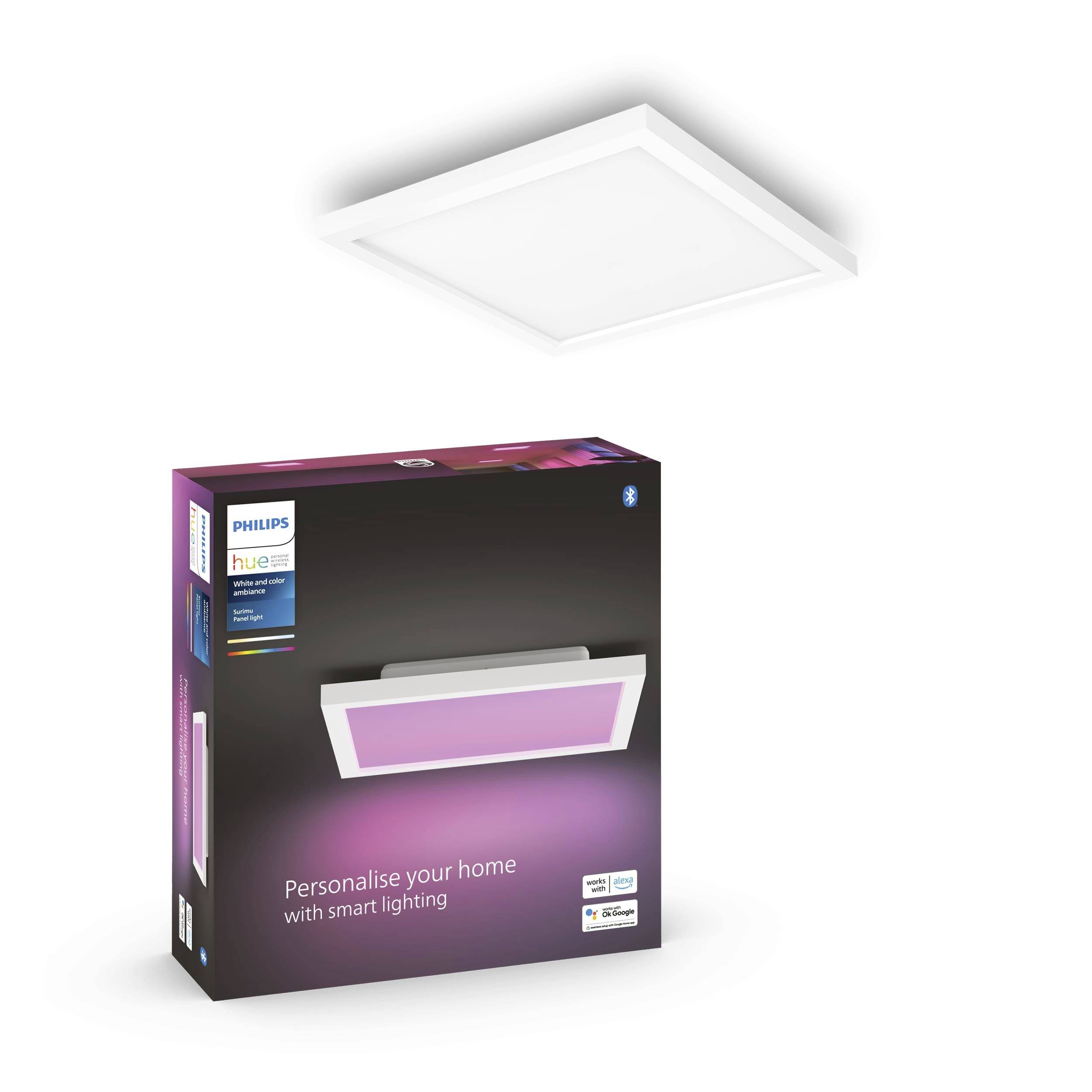 Eine quadratische, weiße Deckenleuchte neben einer Verpackung mit der Aufschrift 'Philips Hue'. Verpackung zeigt ein Bild der Leuchte mit lila Licht.