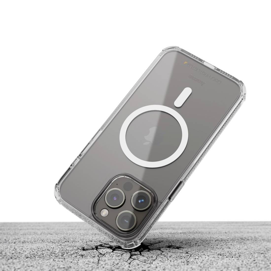 Ein Smartphone in einer durchsichtigen Hülle liegt auf rauem Betonboden. Die Hülle zeigt ein kreisförmiges Design auf der Rückseite.