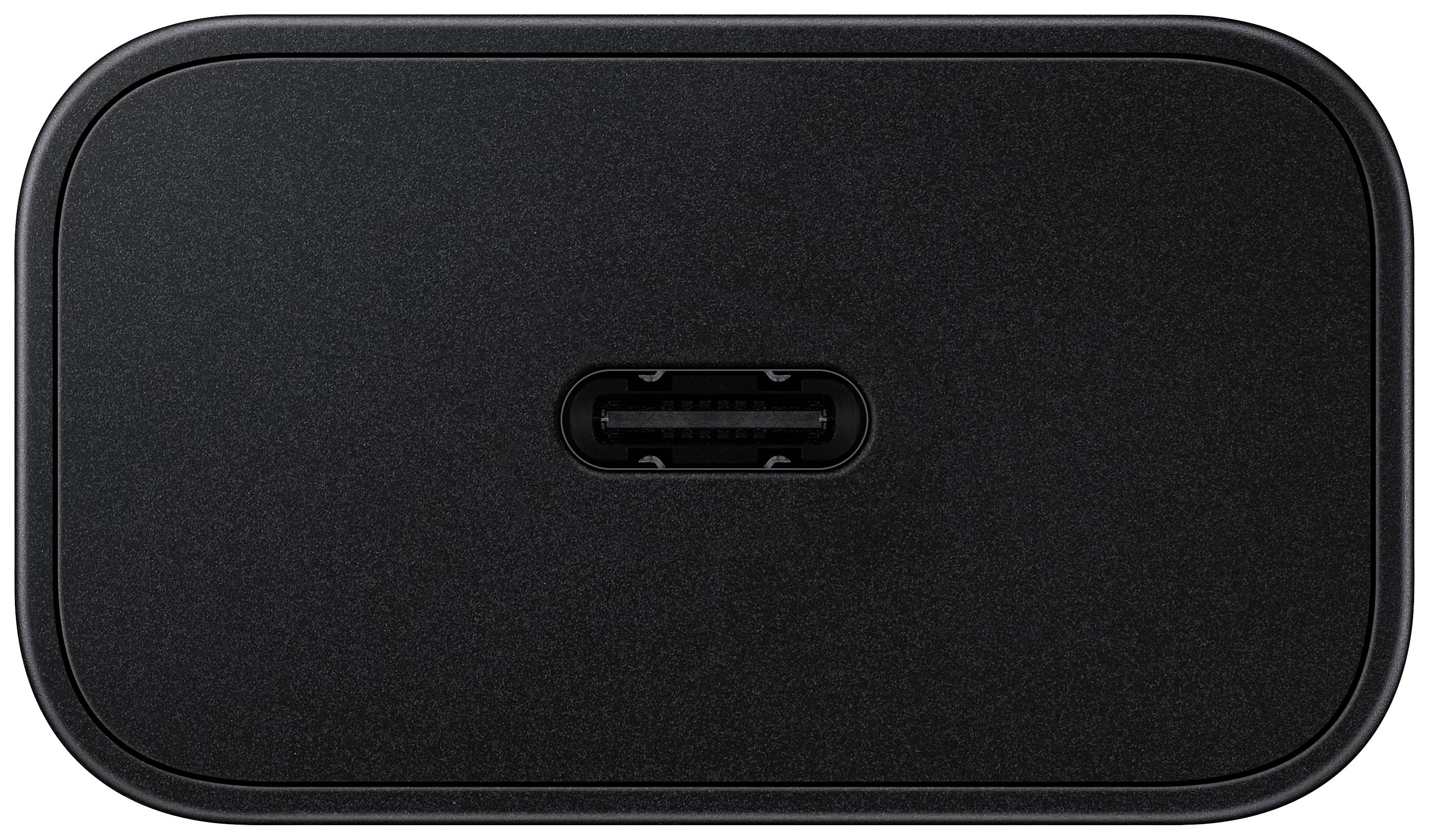 Ein schwarzes, rechteckiges Ladegerät mit abgerundeten Ecken und einem zentralen USB-C-Anschluss.