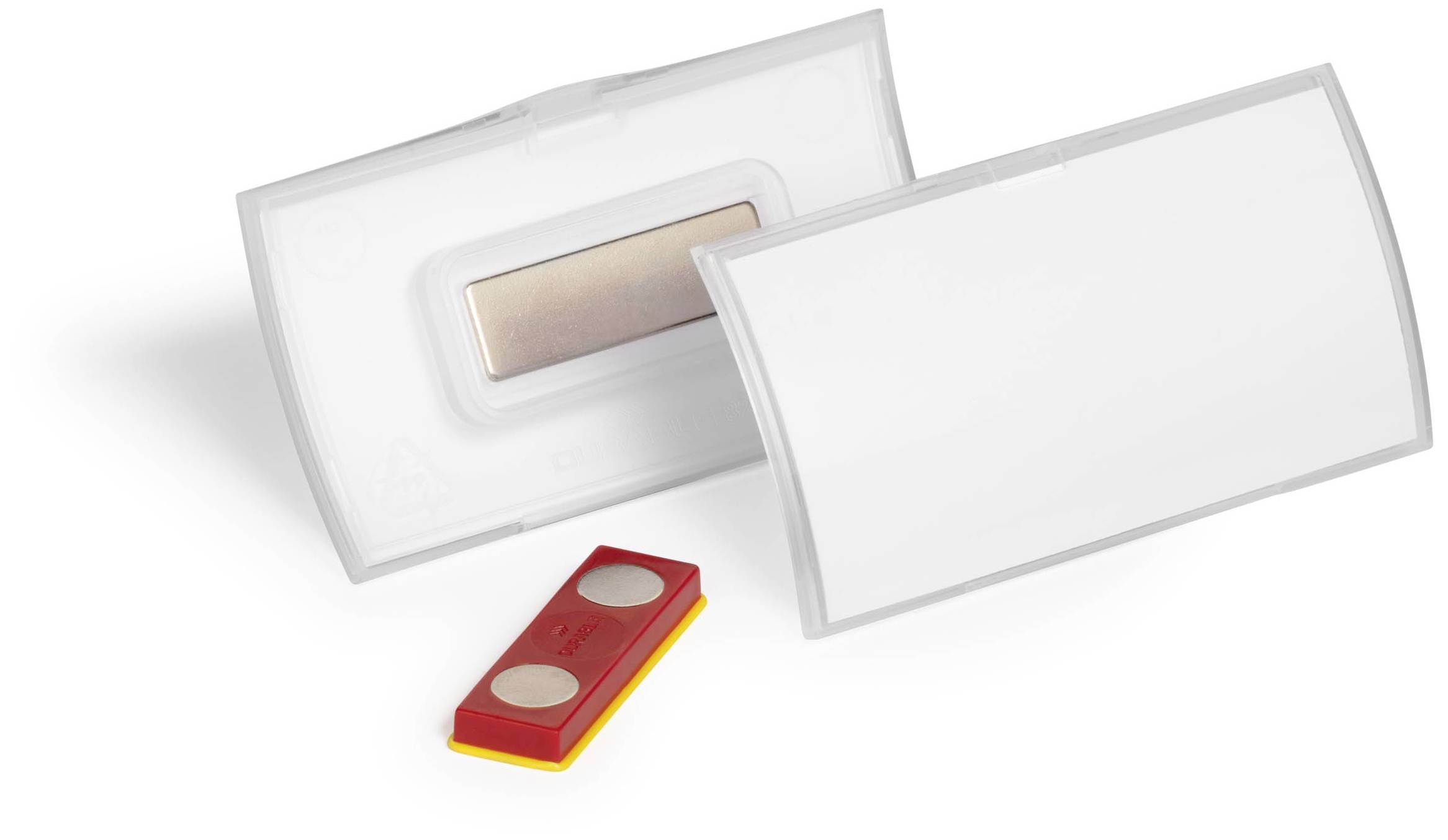 Zwei weiße Kunststoffplatten, eine mit einer rechteckigen Aussparung und eine rote Magnetleiste mit zwei runden Magneten.