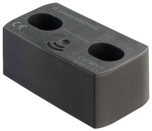 Ein rechteckiger, schwarzer Sensorblock mit zwei Löchern auf der Oberseite, beschriftet mit 'Leuze electronic C/D SK 11'.