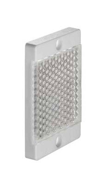 Ein rechteckiger, silberner Reflektor mit diamantförmigem Muster; seitliche Befestigungslöcher, vermutlich zur Montage an Wänden oder Fahrzeugen.