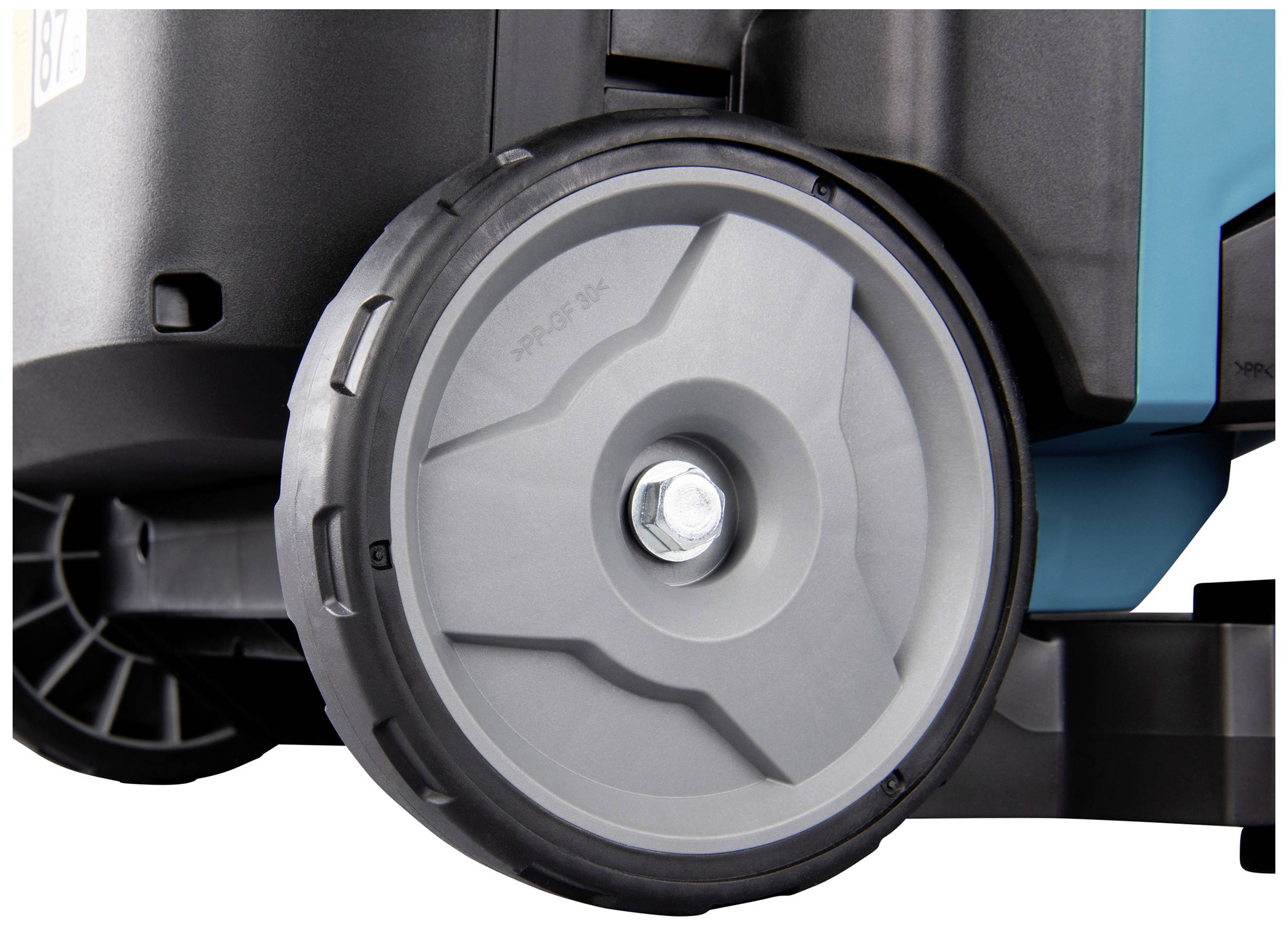 Das Bild zeigt ein großes graues Rad eines industriellen Geräts mit robustem Felgendesign, geeignet für schwere Lasten.