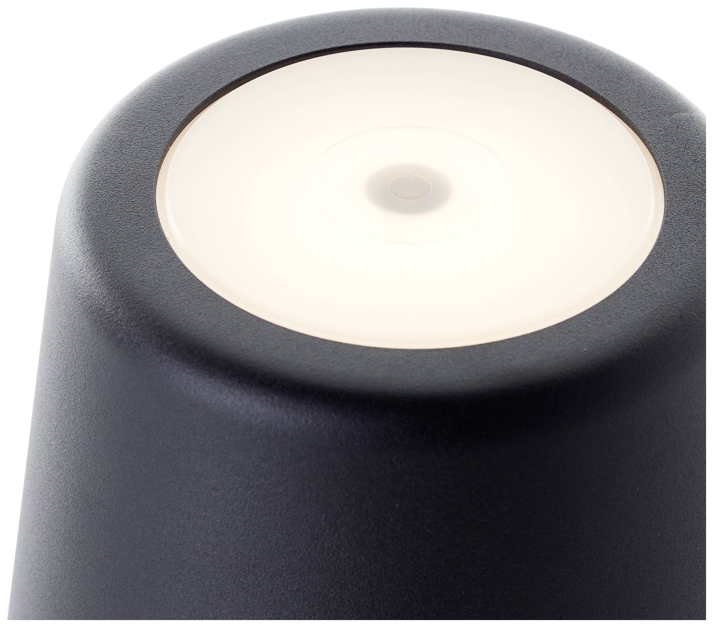 Obenansicht einer schwarzen zylindrischen Lampe mit weißem leuchtendem Licht in der Mitte.