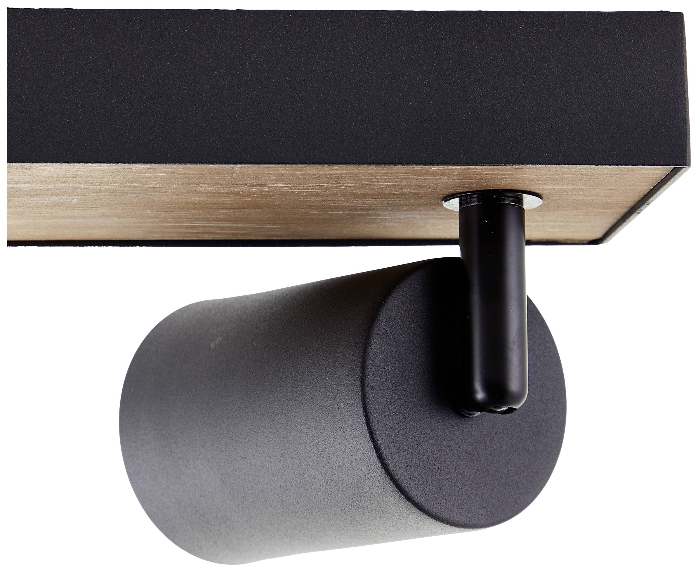 Schwarzer zylindrischer Strahler an einer Decke, betont modernes Design und minimalistische Ästhetik.