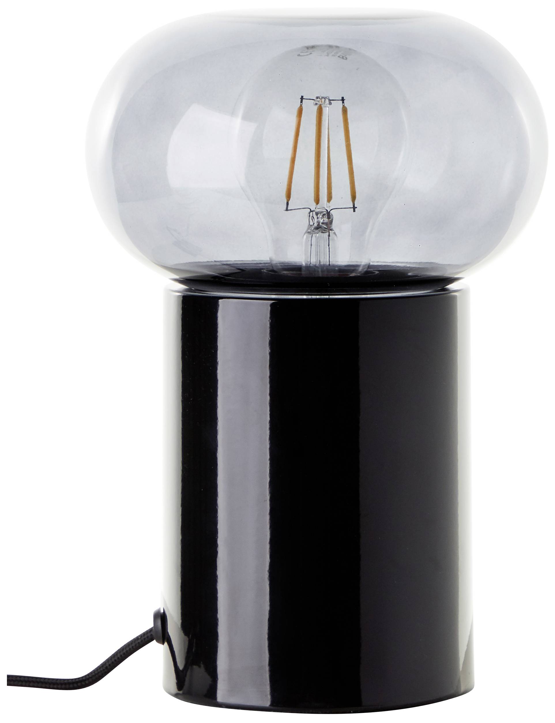 Eine moderne Tischlampe mit schwarzem Zylindersockel und großer, durchsichtiger Glühbirne.