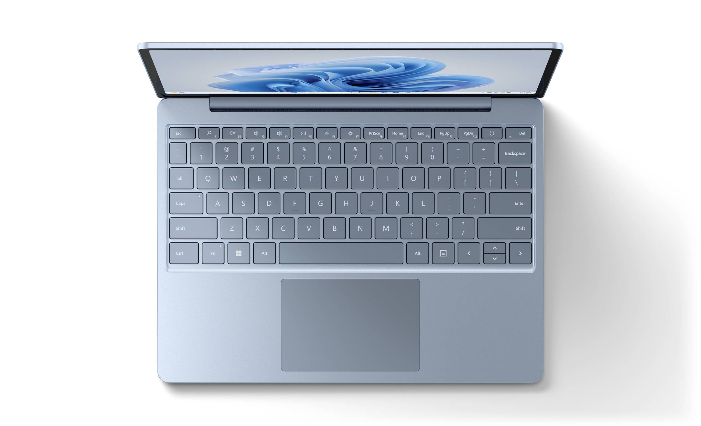 Ein geöffneter Laptop von oben betrachtet mit einer Tastatur in voller Ansicht. Der Bildschirm zeigt unscharfe, blaue Formen.