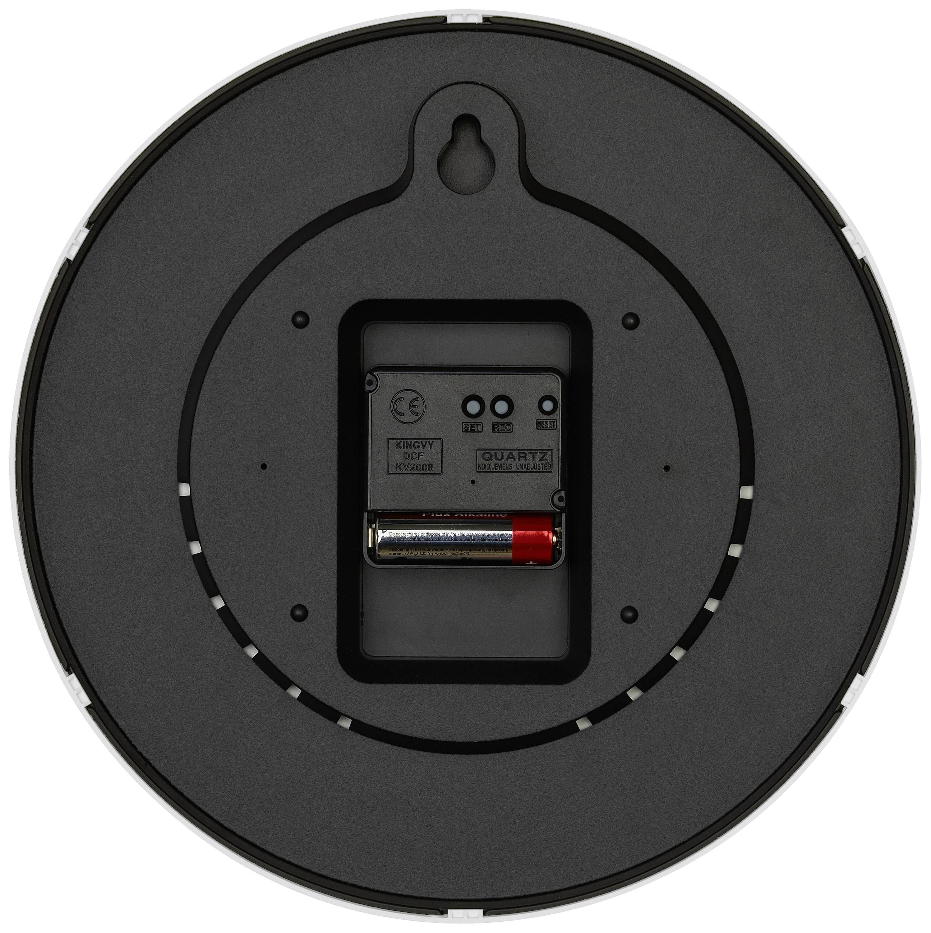 Rückseite einer runden Wanduhr mit Batteriefach und Quarzuhrwerk. Eine AA-Batterie ist eingesetzt.
