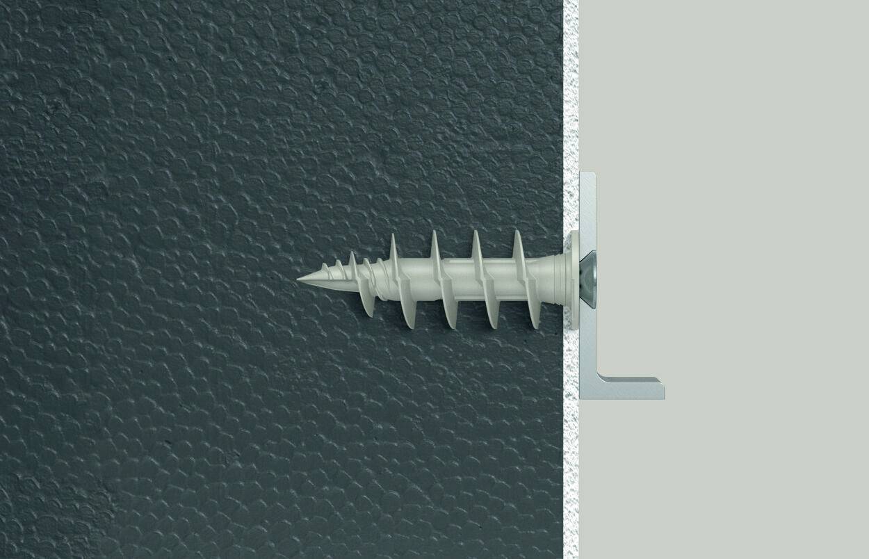 Eine Schraube wird in die Wand eingeschraubt, seitlich gezeigt. Die Schraube hat ein grobes Gewinde und durchdringt eine dunkle Oberfläche.