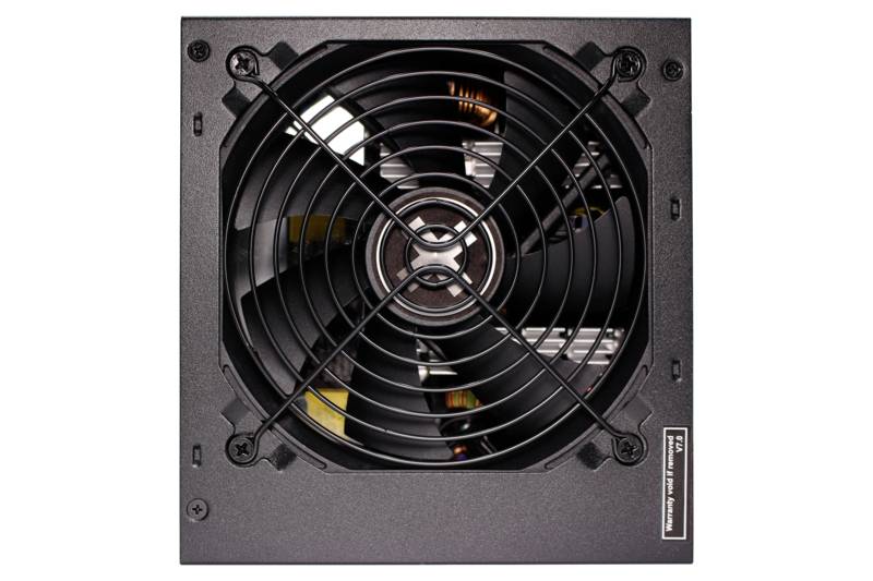 Ein schwarzes Computernetzteil von oben, mit einem Lüftergitter und sichtbaren Schrauben an den Ecken zur Befestigung.