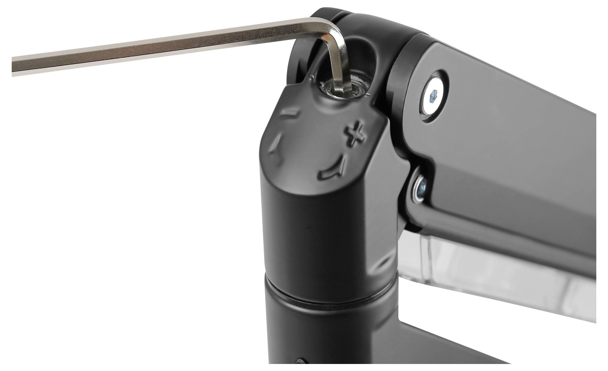 Nahaufnahme eines Gelenkmechanismus mit einem Inbusschlüssel, der eine Schraube justiert. Ein '+' und '-' Symbol sind sichtbar.