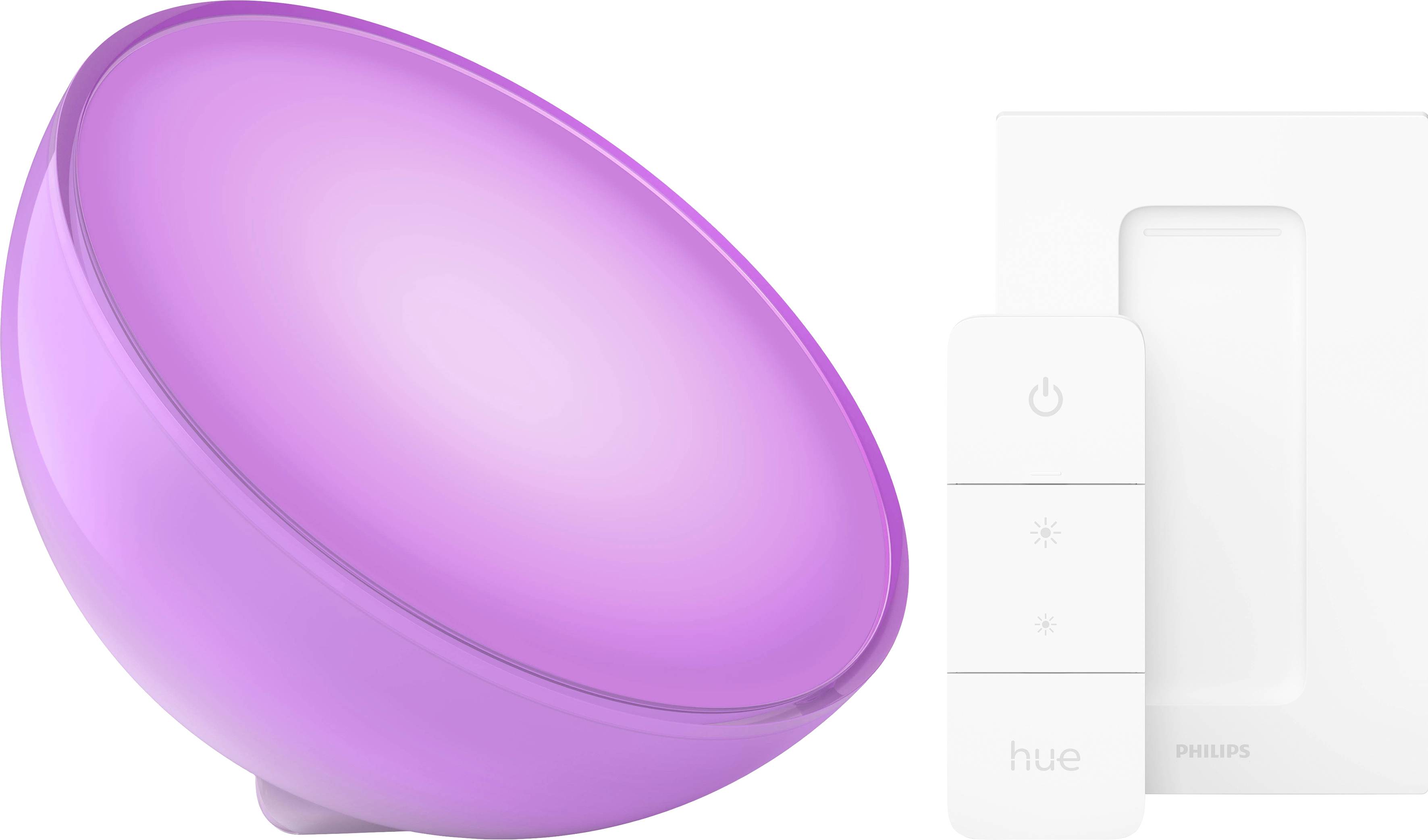 Ein rosa leuchtendes, rundes Philips Hue Licht neben einer weißen Fernbedienung mit zwei Knöpfen zur Helligkeitssteuerung.